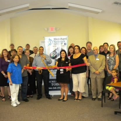The Merchant Network Group team at a ribbon cutting in Florida